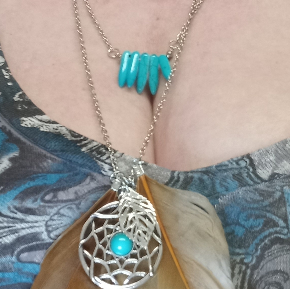 Silver & turquoise necklace with feathers & dreamcatcher design.